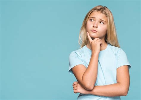 Girl With Thinking Gesture Free Photo