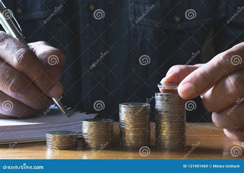 Business Man Putting Coin On Pile Of Money Saving Bank And Account For