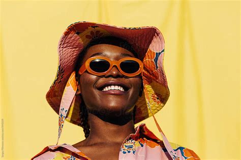 Delighted Black Woman In Sunglasses And Sunhat By Stocksy Contributor Serge Filimonov Stocksy