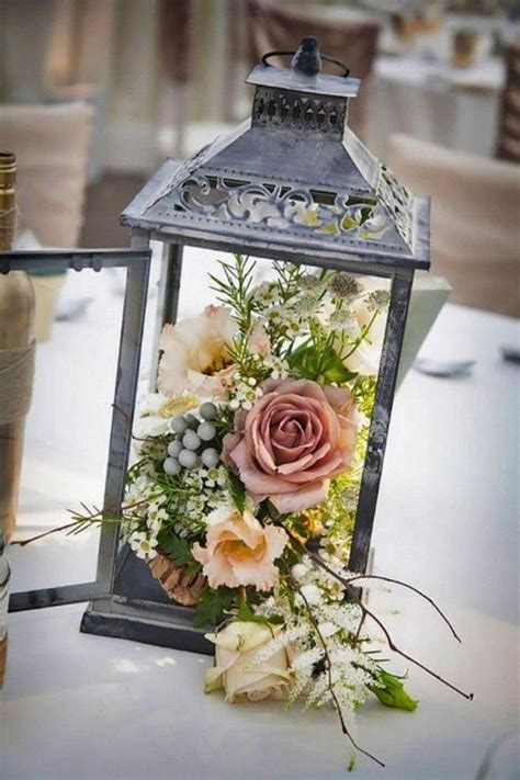 Rustic Lantern With Flowers Wedding Centerpieces Simplewedding In 2020