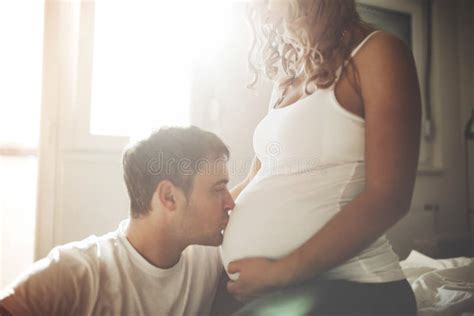 Husband Kissing Pregnant Wife Belly Stock Photo Image Of Caucasian Parent