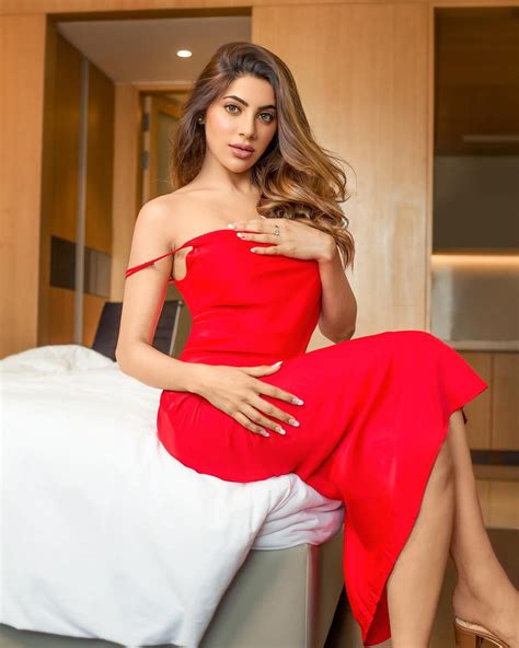 nikki tamboli bowls fans over with sexy looks in red strappy dress check out diva s hottest