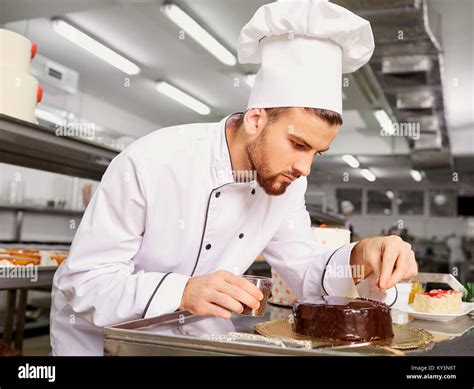 Man Confectioner With A Cake In His Hands In The Pastry Stock Photo Alamy