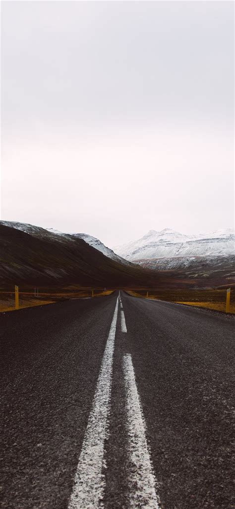 Gray Asphalt Road Under Cloudy Sky Iphone Wallpapers Free Download
