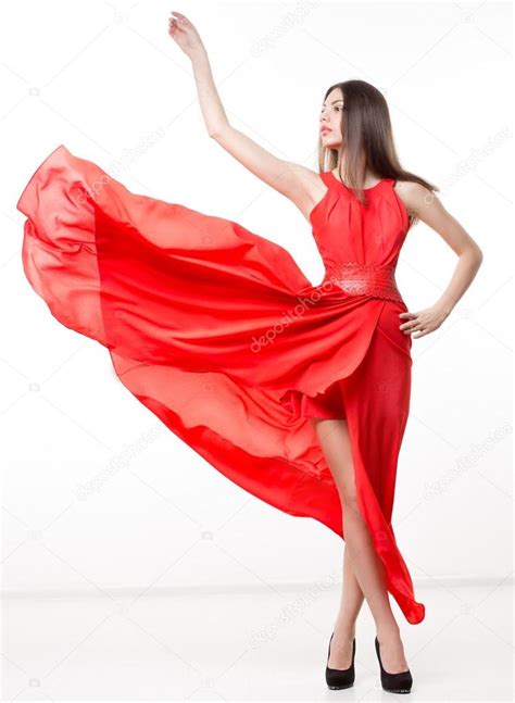 Young Beauty Woman In Fluttering Red Dress Stock Photo By ©kopitin
