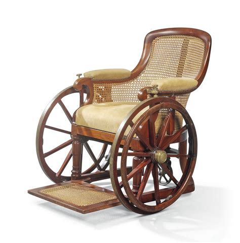 An Early Victorian Brass Mounted Mahogany And Caned Wheelchair