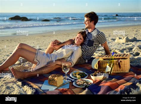 Happy Adult Caucasian Couple Having Fun On The Beach Hi Res Stock