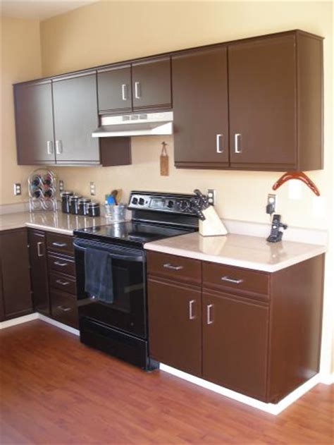 Planning and updating kitchen prime the cabinets. Refinishing Laminate Cabinets | ThriftyFun