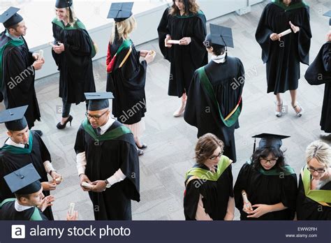 College Graduates And Professors Socializing Stock Photo Alamy