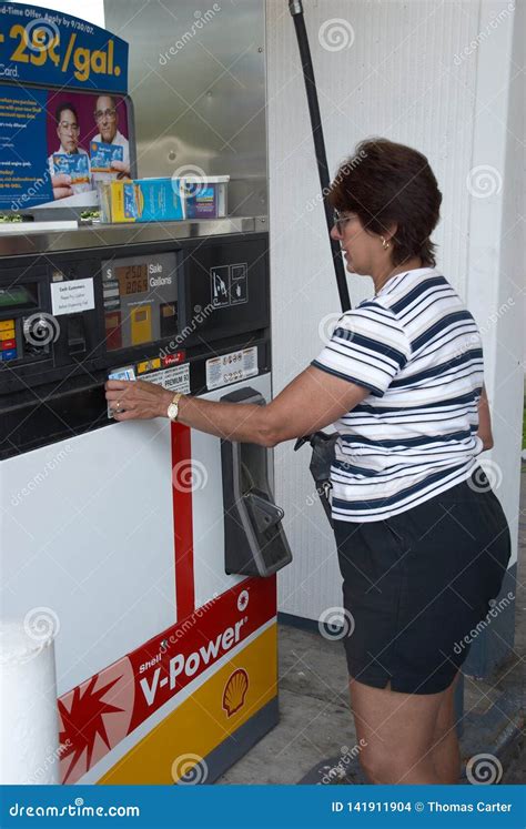 Woman Purchasing Gasoline At A Gas Pump In Belleville Michigan Editorial Stock Image Image Of