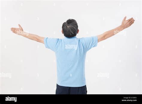 An Old Man Stretching His Arms Out Stock Photo Alamy