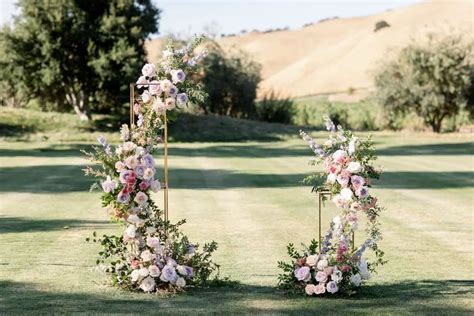 53 Next Level Wedding Arches For Every Type Of Couple Blue Wedding Flowers Wedding Arch