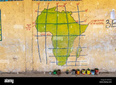 A Hand Painted Map Of Africa On A Wall Depicting Latitude And