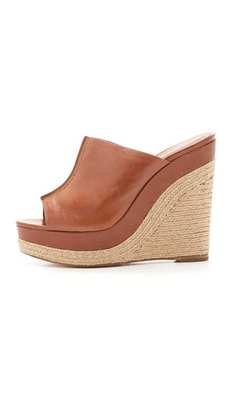 Lyst Michael Kors Charlize Wedge Mules In Brown