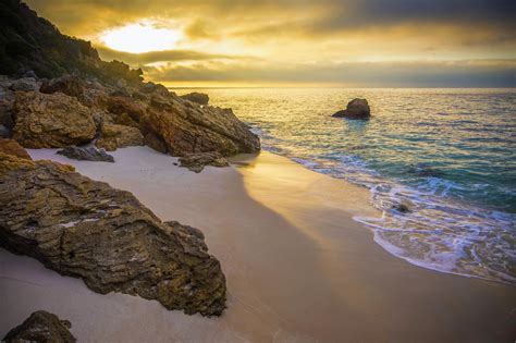 Ocean Rocks Sand Sunrise Beach Wallpapers Hd Desktop And Mobile