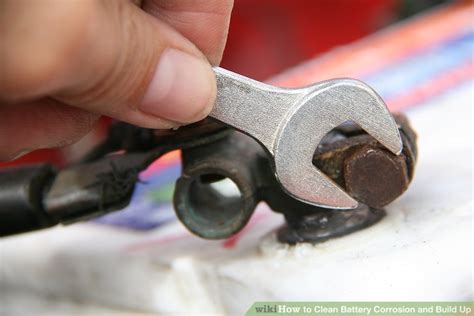 Dip an old toothbrush into the mixture and scrub the top of the battery to remove corrosion buildup. How to Clean Battery Corrosion and Build Up (with Pictures)