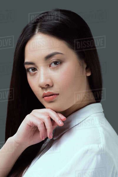 Portrait Of Beautiful Babe Asian Woman Looking At Camera Isolated On Grey Stock Photo Dissolve