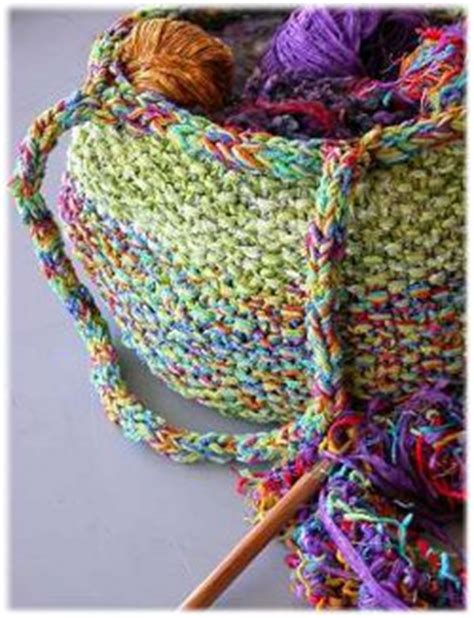 If you liked this knit tote bag project, you might also enjoy this crochet coin purse tutorial! Colorful Knitting Tote Bag | AllFreeKnitting.com
