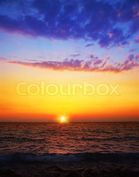 Beautiful Sunset On The Beach Seascape With Calm Water