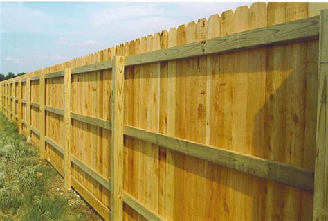 Neither posts nor rails can be seen on the outside of this fence. A Homeowner's Guide to Fences