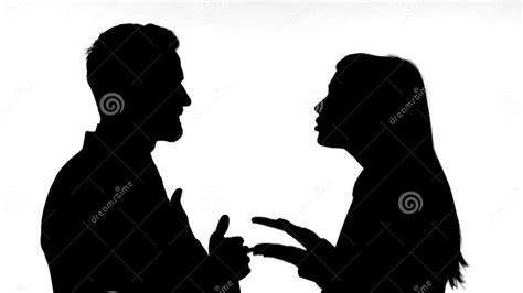 The Silhouette Of Couple Fighting Against White Background Stock Photo