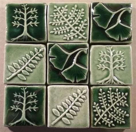 Green And White Ceramic Tiles With Tree Designs On The Sides All In