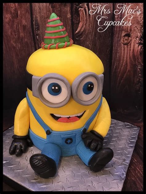 It is a cake that looks just like a minion from the animation despicable me. Bob minion cake. | Cake designs, Cake, Cupcakes