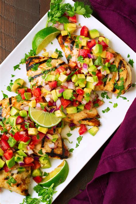 Juicy grilled chicken in a cilantro lime marinade, topped with fresh strawberry salsa and avocado. Cilantro-Lime Chicken with Avocado Salsa - Cooking Classy
