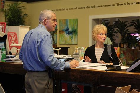 All mattresses come with a factory warranty. Mattress Mack assisting a Gallery Furniture customer ...