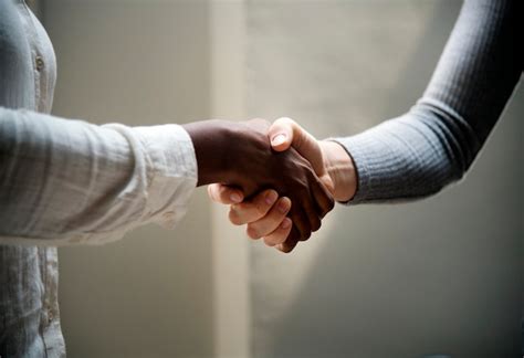 Free Photo Two Business People Shaking Hands