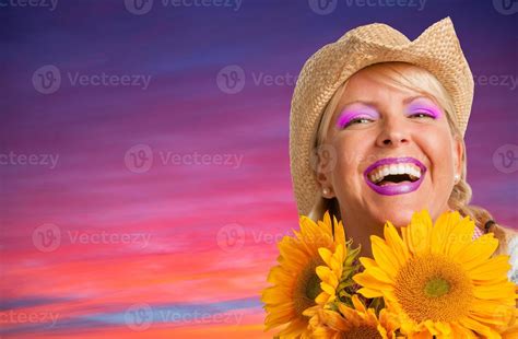 Beautiful Laughing Girl Wearing Cowboy Hat Holding Yellow Sunflowers