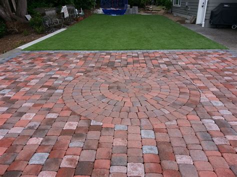 A paver patio makes a great relaxation spot, especially if you design it creatively and beautifully. Patio using Old Dominion Square and Recs with circle kit ...