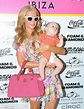 PHOTO Paris Hilton poses with a baby at handbag launch in Ibiza