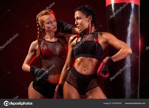 Two Sexy Women Sportsman Boxer Doing Boxing Training At The Gym Girl