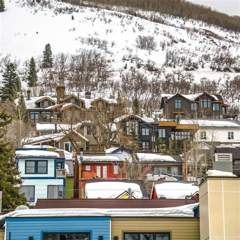 Square Houses And Trees On A Mountain Slope With Snow During Winter In