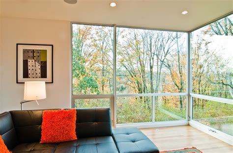 Put the fireplace in the between of the two floors to ceiling widow like this. Floor To Ceiling Windows: The Identity of Modern Home ...