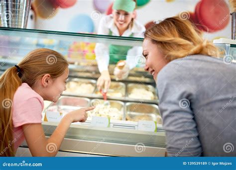 Mother And Daughter Chooses Ice Cream In Confectionery Stock Image Image Of Employee Homemade