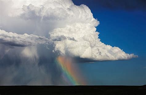 Cumulonimbus Cloud Over Sheets Of Rain And Rainbow Colo © Ed Darack