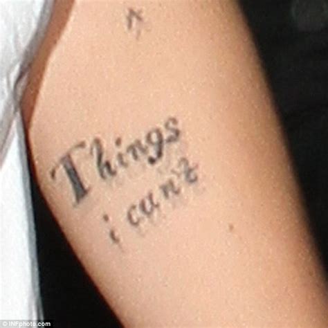 Harry Styles Shows Off Incomplete Tattoos As One Direction Prepare For