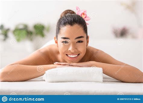 Beautiful Asian Woman Relaxing In Spa Salon Lying On Massage Table Stock Image Image Of Asian