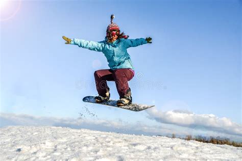 Young Woman On The Snowboard Jumping Stock Photo Image Of Mountain