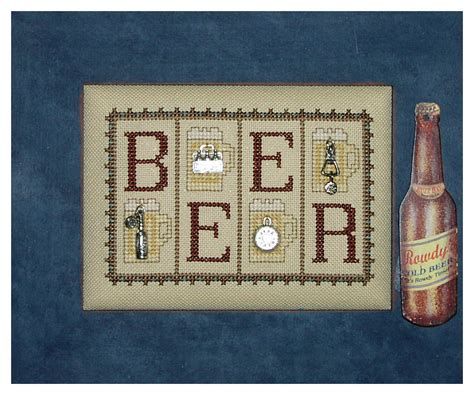 A Beer Bottle Sitting Next To A Cross Stitch Pattern With The Word