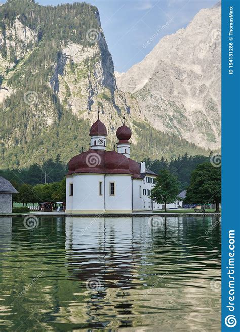 Lake Koenigssee With St Bartholomew S Church Surrounded By Mountains In