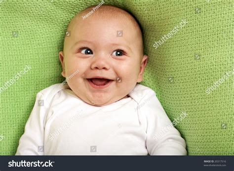 Cute Happy Baby Boy Smiling On Green Background Stock Photo 20317516