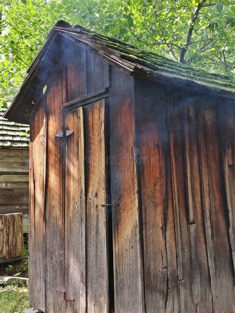 Rustic Old Meat Smokehouse With Smoke Leaking Out Stock Photo Image