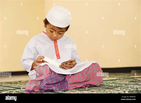 Child Reading Koran Stock Photo Alamy