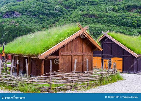 Traditional Norwegian Wooden Houses With Grass On The Roof In Norway