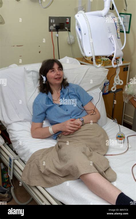 Woman Lying On Nhs Hospital Bed Of Having Had An Amputation Of The Left