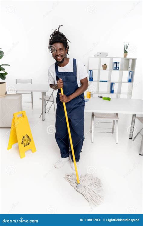 Cheerful African American Cleaner Holding Mop And Smiling Stock Image