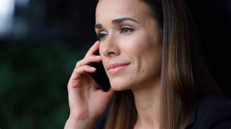 Serious Businesswoman Face Talking On Smartphone Closeup Female